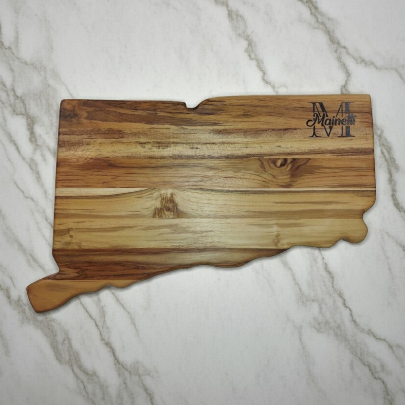 Custom Connecticut state-shaped teak wood board with a large laser-engraved monogram and family name.