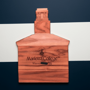 Custom building-shaped teak wood charcuterie board featuring a laser-engraved Marietta College Erwin Hall logo and name.