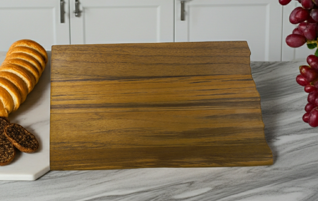 Large 16.5-inch North Dakota teak charcuterie board styled as kitchen decor