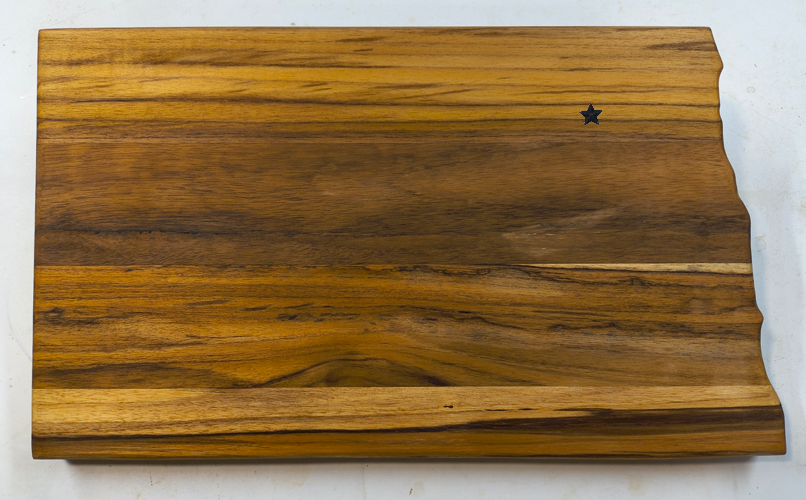 North Dakota Teak charcuterie board with star in a personalized location.