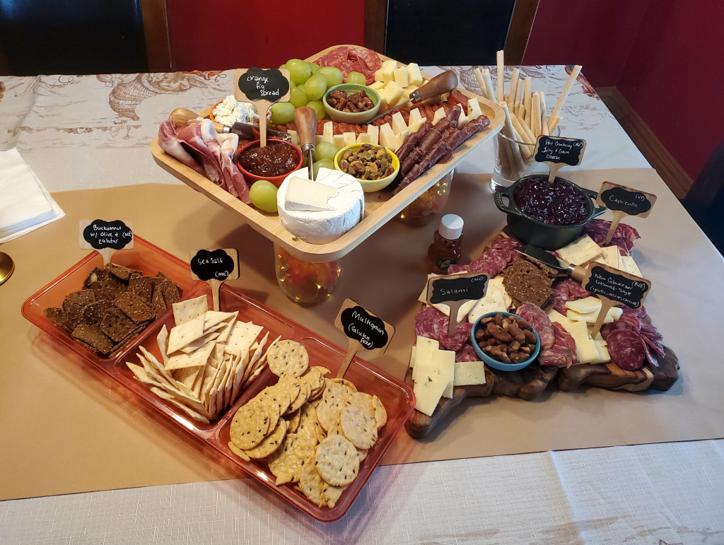 Maine state shaped charcuterie board loaded with meats and cheeses from Maine